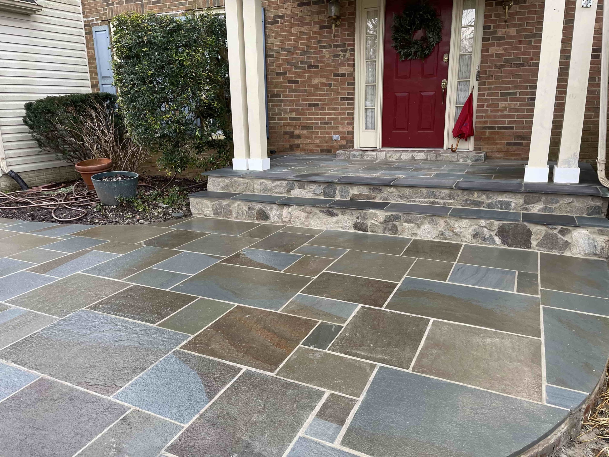 Stone patio by ProLandscapes in MD