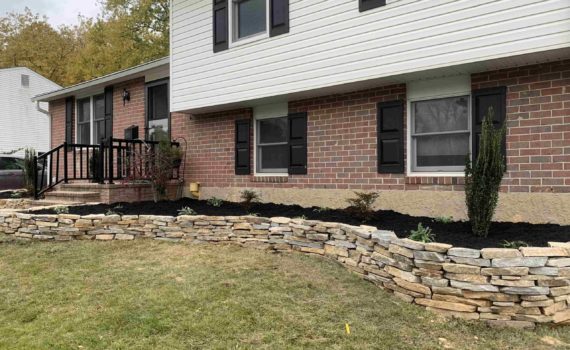 Stone retaining wall by ProLandscapes in MD