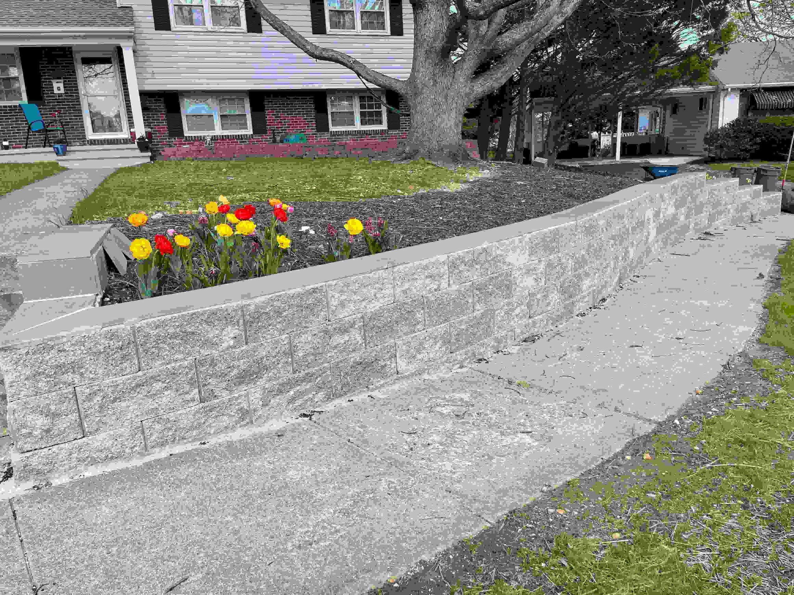 Stone retaining wall by ProLandscapes MD