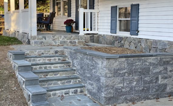 Stone patio with stairs by ProLandscapes in MD